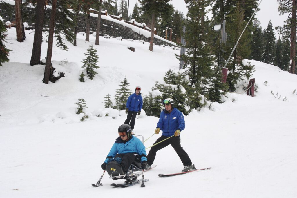 Fernando skiing at Northstar with his Achieve Tahoe instructors, Dave and Sam
